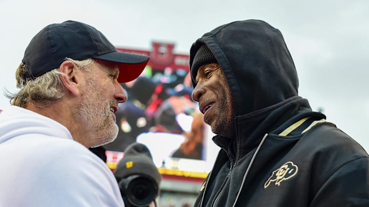 Nov 25, 2023; Salt Lake City, Utah, USA; Colorado Buffaloes head coach Deion 'Coach Prime' Sanders congratulates Utah Utes head coach Kyle Whittingham after the Utah Utes victory over the Colorado Buffaloes at Rice-Eccles Stadium. Mandatory Credit: Christopher Creveling-Imagn Images Nov 25, 2023; Salt Lake City, Utah, USA; Colorado Buffaloes head coach Deion 'Coach Prime' Sanders congratulates Utah Utes head coach Kyle Whittingham after the Utah Utes victory over the Colorado Buffaloes at Rice-Eccles Stadium. Mandatory Credit: Christopher Creveling-Imagn Images