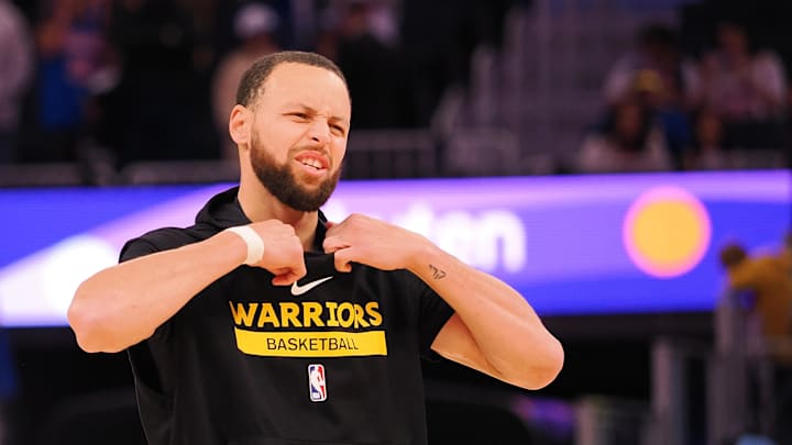 Jan 23, 2025; San Francisco, California, USA; Golden State Warriors guard Stephen Curry (30) removes his sleeveless hoodie during warm ups before the game against the Chicago Bulls at Chase Center. Mandatory Credit: Kelley L Cox-Imagn Images