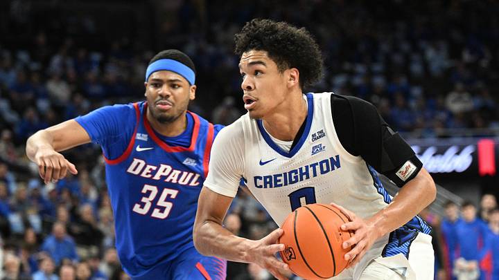 Feb 25, 2026; Omaha, Nebraska, USA; Creighton Bluejays forward Jasen Green (0) drives against DePaul Blue Demons forward N.J. Benson (35) during the second half at CHI Health Center Omaha. Mandatory Credit: Steven Branscombe-Imagn Images Feb 25, 2026; Omaha, Nebraska, USA; Creighton Bluejays forward Jasen Green (0) drives against DePaul Blue Demons forward N.J. Benson (35) during the second half at CHI Health Center Omaha. Mandatory Credit: Steven Branscombe-Imagn Images