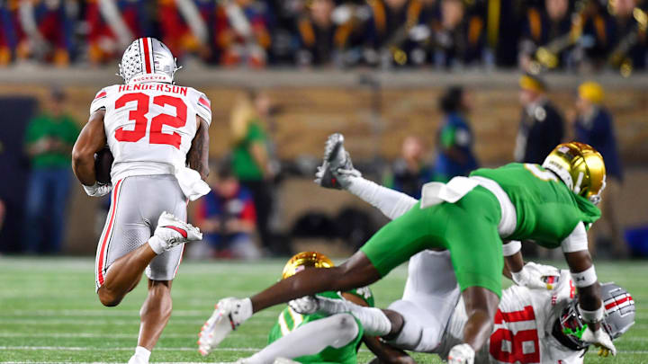 Sep 23, 2023; South Bend, Indiana, USA; Ohio State Buckeyes running back TreVeyon Henderson (32) runs for a touchdown in the third quarter against the Notre Dame Fighting Irish at Notre Dame Stadium. Mandatory Credit: Matt Cashore-Imagn Images