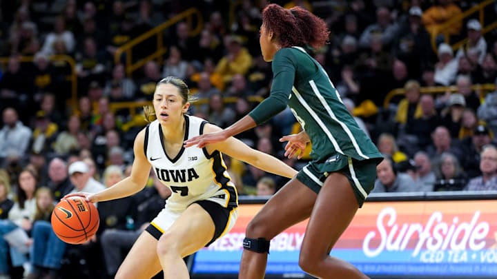 Iowa guard Addie Deal (7) sets up the offense as Michigan State guard Jalyn Brown (23) defends Jan. 18, 2026 at Carver-Hawkeye Arena in Iowa City, Iowa.