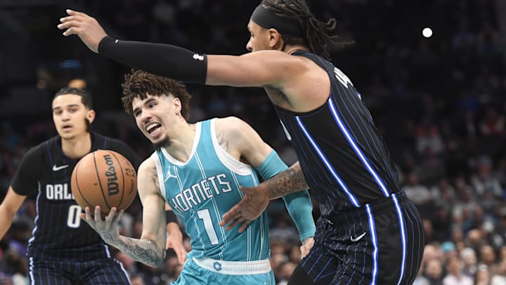 Mar 25, 2025; Charlotte, North Carolina, USA;  Charlotte Hornets guard LaMelo Ball (1) drives in during the second half against the Orlando Magic at the Spectrum Center. Mandatory Credit: Sam Sharpe-Imagn Images