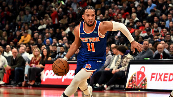 Mar 27, 2024; Toronto, Ontario, CAN;  New York Knicks guard Jalen Brunson (1) dribbles the ball against the Toronto Raptors in the first half at Scotiabank Arena. Mandatory Credit: Dan Hamilton-Imagn Images