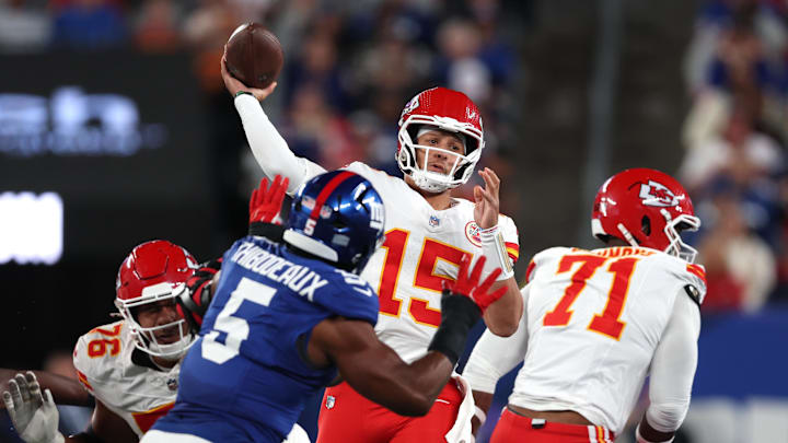 Sep 21, 2025; East Rutherford, New Jersey, USA; Kansas City Chiefs quarterback Patrick Mahomes (15) throws a pass against New York Giants linebacker Kayvon Thibodeaux (5) at MetLife Stadium. Mandatory Credit: Vincent Carchietta-Imagn Images