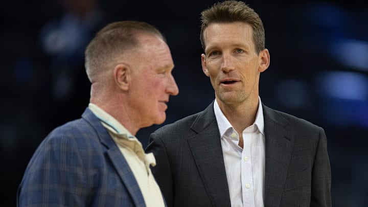 Oct 18, 2023; San Francisco, California, USA; Golden State Warriors General Manager Mike Dunleavy (right) chats with Warriors great Chris Mullin before taking on the Sacramento Kings at Chase Center. Mandatory Credit: D. Ross Cameron-Imagn Images