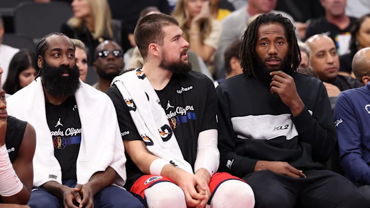 Nov 22, 2024; Inglewood, California, USA; Los Angeles Clippers guard James Harden (1, left) and center Ivica Zubac (40, center) and Kawhi Leonard (right) watch a game from the bench during the second half against the Sacramento Kings at Intuit Dome. Mandatory Credit: Kiyoshi Mio-Imagn Images Nov 22, 2024; Inglewood, California, USA; Los Angeles Clippers guard James Harden (1, left) and center Ivica Zubac (40, center) and Kawhi Leonard (right) watch a game from the bench during the second half against the Sacramento Kings at Intuit Dome. Mandatory Credit: Kiyoshi Mio-Imagn Images