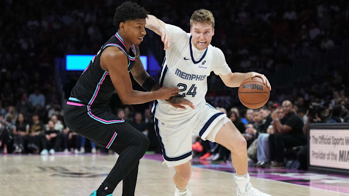 Feb 21, 2026; Miami, Florida, USA; Memphis Grizzlies guard Cam Spencer (24) drives past Miami Heat forward Myron Gardner (15) during the first half at Kaseya Center. Mandatory Credit: Jim Rassol-Imagn Images Feb 21, 2026; Miami, Florida, USA; Memphis Grizzlies guard Cam Spencer (24) drives past Miami Heat forward Myron Gardner (15) during the first half at Kaseya Center. Mandatory Credit: Jim Rassol-Imagn Images