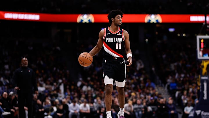Feb 10, 2025; Denver, Colorado, USA; Portland Trail Blazers guard Scoot Henderson (00) dribbles the ball up court in the second quarter against the Denver Nuggets at Ball Arena. Mandatory Credit: Isaiah J. Downing-Imagn Images