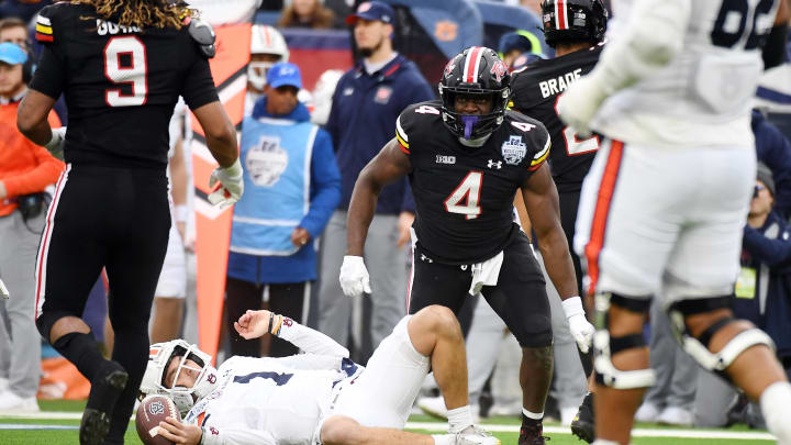 Dec 30, 2023; Nashville, TN, USA; Auburn Tigers quarterback Payton Thorne (1) is tackled by Maryland Terrapins defensive back Tarheeb Still (4) after a short gain during the first half at Nissan Stadium. Mandatory Credit: Christopher Hanewinckel-USA TODAY Sports
