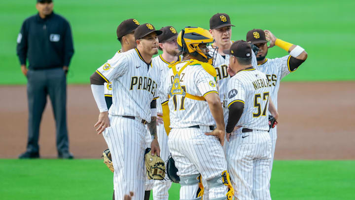 San Diego Padres pitching coach Ruben Niebla (57) talks with San Diego Padres starting pitcher Nick Pivetta (27) during the first inning against the Los Angeles Dodgers at Petco Park on Jun 9, 2025.