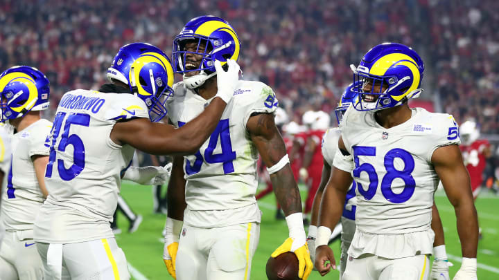Dec 13, 2021; Glendale, Arizona, USA; Los Angeles Rams outside linebacker Leonard Floyd (54) celebrates with linebacker Obo Okoronkwo (45) and outside linebacker Justin Hollins (58) his interception against the Arizona Cardinals during the second half at State Farm Stadium. Mandatory Credit: Mark J. Rebilas-USA TODAY Sports Dec 13, 2021; Glendale, Arizona, USA; Los Angeles Rams outside linebacker Leonard Floyd (54) celebrates with linebacker Obo Okoronkwo (45) and outside linebacker Justin Hollins (58) his interception against the Arizona Cardinals during the second half at State Farm Stadium. Mandatory Credit: Mark J. Rebilas-USA TODAY Sports