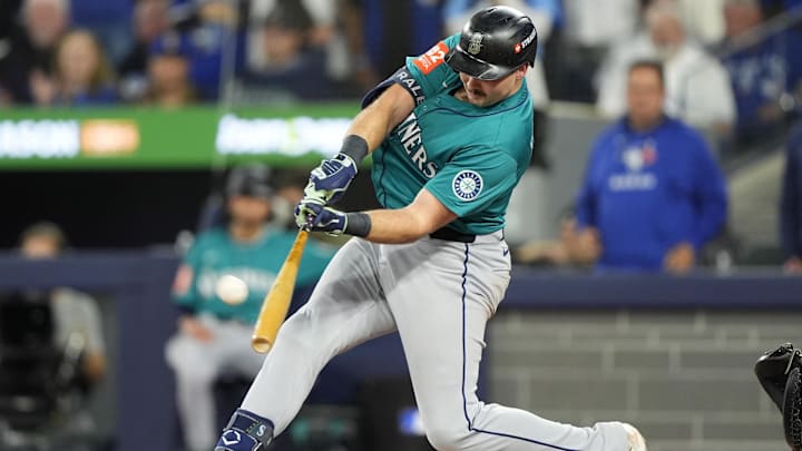 Oct 12, 2025; Toronto, Ontario, CAN; Seattle Mariners catcher Cal Raleigh (29) hits a solo home run in the sixth inning against the Toronto Blue Jays during game one of the ALCS round for the 2025 MLB playoffs at Rogers Centre. Mandatory Credit: John E. Sokolowski-Imagn Images