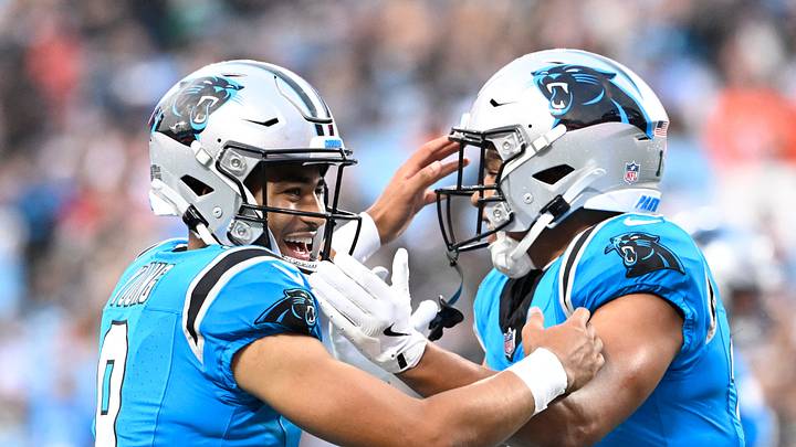 Aug 8, 2025; Charlotte, North Carolina, USA; Carolina Panthers wide receiver Jalen Coker (18) celebrates with quarterback Bryce Young (9) after a touchdown catch in the first quarter at Bank of America Stadium. Mandatory Credit: Bob Donnan-Imagn Images