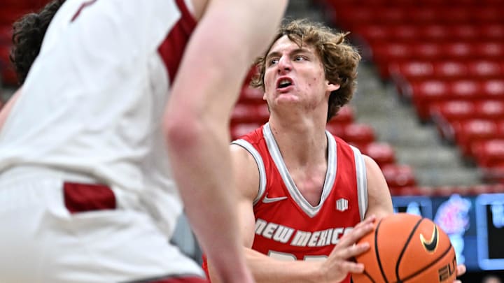 Oct 25, 2025; Pullman, WA, USA; New Mexico Lobos guard Jake Hall (23) shoots the ball against the Washington State Cougars in the first half at Friel Court at Beasley Coliseum. Mandatory Credit: James Snook-Imagn Images