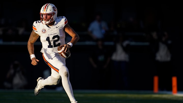 Auburn quarterback Ashton Daniels (12) runs the ball against Vanderbilt on a keeper during the second quarter at FirstBank Stadium in Nashville, Tenn., Saturday, Nov. 8, 2025. Auburn quarterback Ashton Daniels (12) runs the ball against Vanderbilt on a keeper during the second quarter at FirstBank Stadium in Nashville, Tenn., Saturday, Nov. 8, 2025.