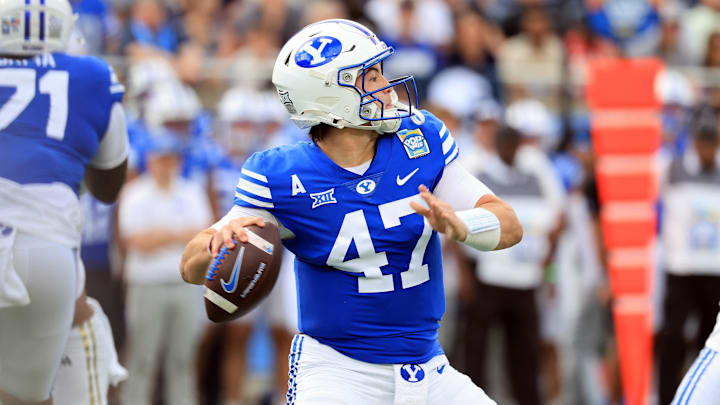 Dec 27, 2025; Orlando, FL, USA; BYU Cougars quarterback Bear Bachmeier (47) throws the ball against the Georgia Tech Yellow Jackets during the first quarter at Camping World Stadium. Mandatory Credit: Kim Klement Neitzel-Imagn Images