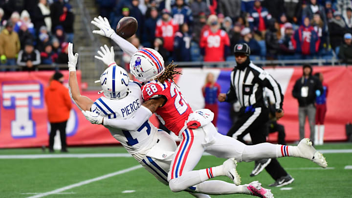 Dec 1, 2024; Foxborough, Massachusetts, USA;  New England Patriots cornerback Alex Austin (28) breaks up a pass intended for Indianapolis Colts wide receiver Alec Pierce (14) during the second half at Gillette Stadium. Mandatory Credit: Bob DeChiara-Imagn Images