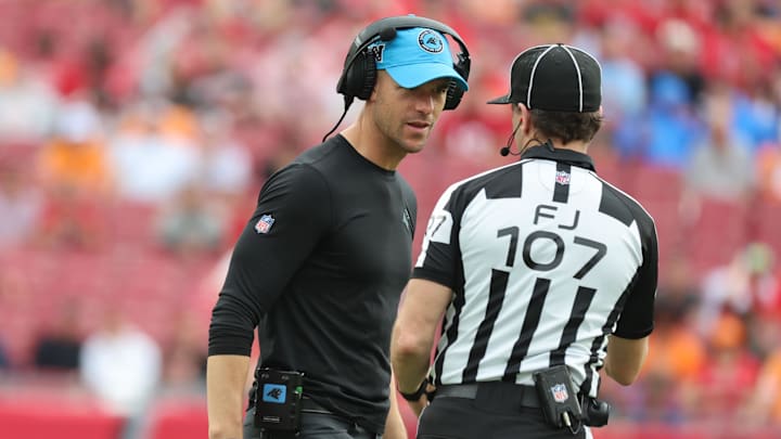 Dec 29, 2024; Tampa, Florida, USA; Carolina Panthers] head coach Dave Canales talks with referee Dave Hawkshaw against the Tampa Bay Buccaneers during the second half at Raymond James Stadium. Mandatory Credit: Kim Klement Neitzel-Imagn Images