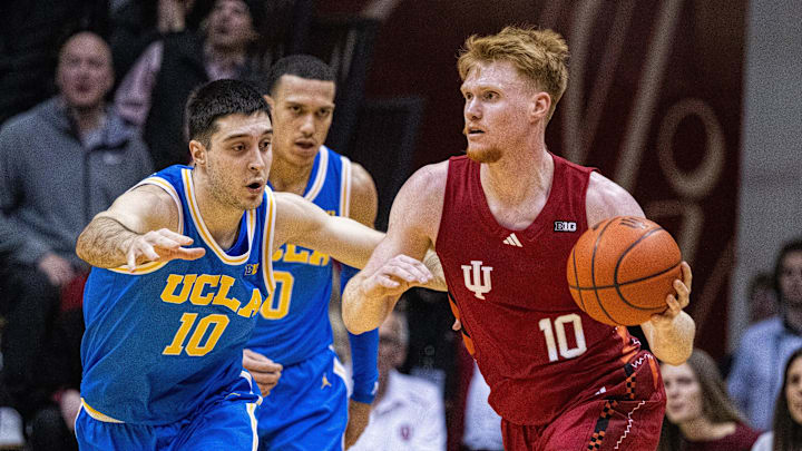 Indiana Hoosiers forward Luke Goode (10) dribbles the ball while UCLA Bruins guard Lazar Stefanovic (10) defends in the second half at Simon Skjodt Assembly Hall.