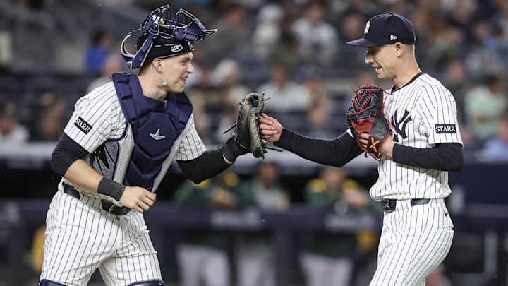 Jun 27, 2025; Bronx, New York, USA;  New York Yankees catcher Ben Rice (22) congratulates relief pitcher Luke Weaver (30) after retiring the side in the eighth inning against the Athletics at Yankee Stadium. Mandatory Credit: Wendell Cruz-Imagn Images