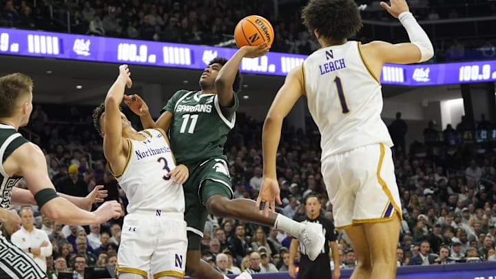 Jan 12, 2025; Evanston, Illinois, USA; Northwestern Wildcats guard Ty Berry (3) defends Michigan State Spartans guard Jase Richardson (11) during the first half at Welsh-Ryan Arena. Mandatory Credit: David Banks-Imagn Images