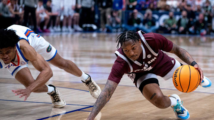 Texas A&M Aggies guard Wade Taylor IV (4) goes to the ground after being fouled by Florida