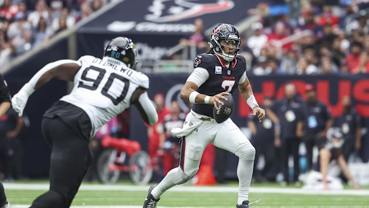Sep 29, 2024; Houston, Texas, USA; Houston Texans quarterback C.J. Stroud (7) runs with the ball during the fourth quarter against the Jacksonville Jaguars at NRG Stadium. Mandatory Credit: Troy Taormina-Imagn Images