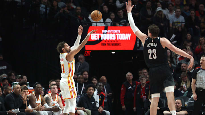 Nov 17, 2024; Portland, Oregon, USA; Atlanta Hawks guard Trae Young (11) shoots the ball over Portland Trail Blazers center Donovan Clingan (23) in the first half at Moda Center. Mandatory Credit: Jaime Valdez-Imagn Images Nov 17, 2024; Portland, Oregon, USA; Atlanta Hawks guard Trae Young (11) shoots the ball over Portland Trail Blazers center Donovan Clingan (23) in the first half at Moda Center. Mandatory Credit: Jaime Valdez-Imagn Images