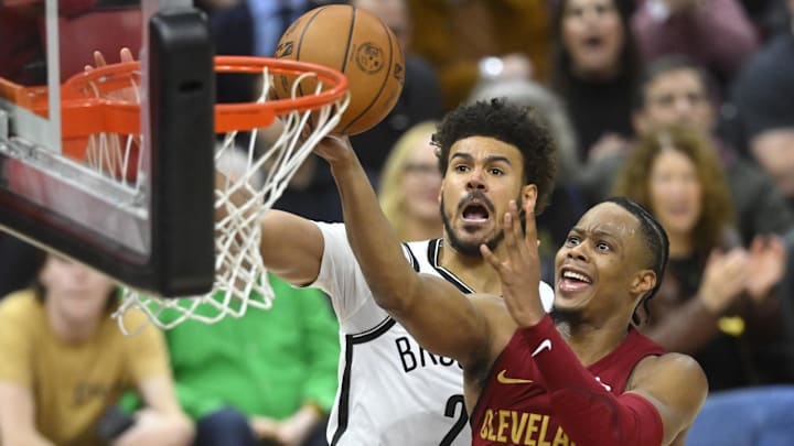 Mar 11, 2025; Cleveland, Ohio, USA; Cleveland Cavaliers forward Isaac Okoro (35) drives to the basket beside Brooklyn Nets forward Cameron Johnson (2) in the fourth quarter at Rocket Arena. Mandatory Credit: David Richard-Imagn Images Mar 11, 2025; Cleveland, Ohio, USA; Cleveland Cavaliers forward Isaac Okoro (35) drives to the basket beside Brooklyn Nets forward Cameron Johnson (2) in the fourth quarter at Rocket Arena. Mandatory Credit: David Richard-Imagn Images