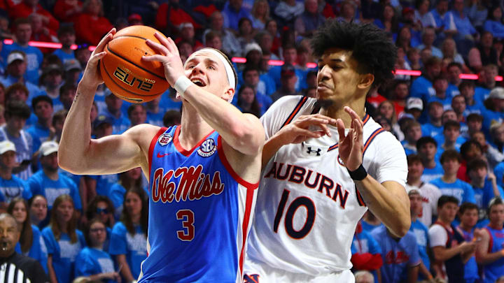 Feb 1, 2025; Oxford, Mississippi, USA; Mississippi Rebels guard Sean Pedulla (3) drives to the basket as Auburn Tigers guard Chad Baker-Mazara (10) defends during the second half at The Sandy and John Black Pavilion at Ole Miss. Mandatory Credit: Petre Thomas-Imagn Images