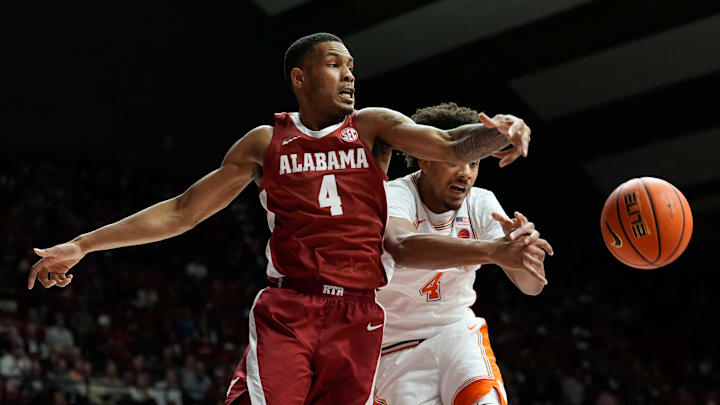 Dec 3, 2025; Tuscaloosa, AL, USA; Alabama guard Davion Hannah (4) and Clemson guard Butta Johnson (4) battle for a ball at Coleman Coliseum. Mandatory Credit: Gary Cosby Jr.-Tuscaloosa News