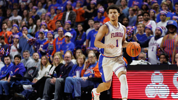 Dec 4, 2024; Gainesville, Florida, USA; Florida Gators guard Walter Clayton Jr. (1) dribbles the ball against the Virginia Cavaliers during the second half at Exactech Arena at the Stephen C. O'Connell Center. Mandatory Credit: Matt Pendleton-Imagn Images