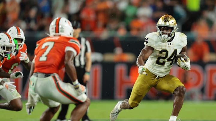 Aug 31, 2025; Miami Gardens, Florida, USA; Notre Dame Fighting Irish running back Jadarian Price (24) rushes the ball against the Miami Hurricanes during the second quarter at Hard Rock Stadium. Mandatory Credit: Sam Navarro-Imagn Images