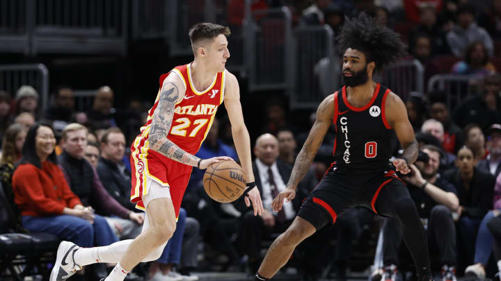 Apr 1, 2024; Chicago, Illinois, USA; Atlanta Hawks guard Vit Krejci (27) drives to the basket against Chicago Bulls guard Coby White (0) during the first half at United Center. Mandatory Credit: Kamil Krzaczynski-USA TODAY Sports