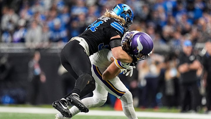 Detroit Lions linebacker Alex Anzalone (34) tackles Minnesota Vikings tight end T.J. Hockenson (87) during the second half at Ford Field in Detroit on Sunday, Jan. 5, 2025.