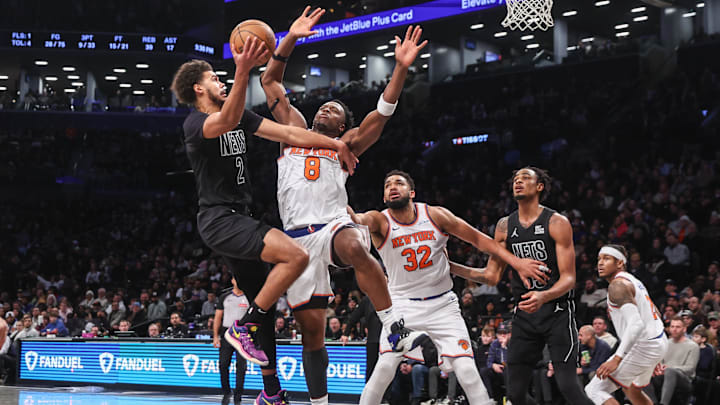 Brooklyn Nets forward Cameron Johnson (2) looks to drive past New York Knicks forward OG Anunoby (8) in the fourth quarter at Barclays Center. Mandatory Credit: Wendell Cruz-Imagn Images