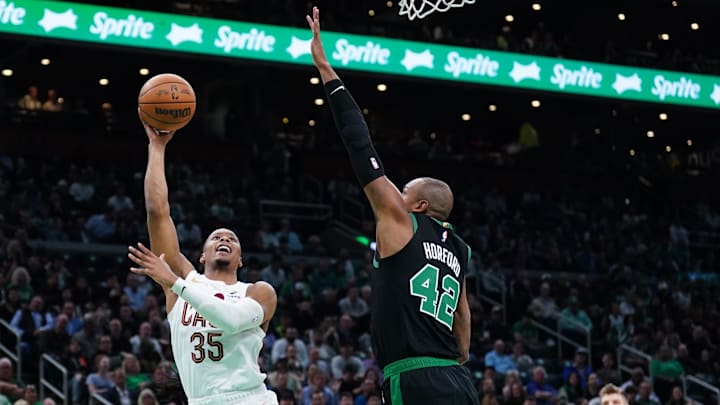 May 15, 2024; Boston, Massachusetts, USA; Cleveland Cavaliers forward Isaac Okoro (35) shoots against Boston Celtics center Al Horford (42) in the first quarter during game five of the second round for the 2024 NBA playoffs at TD Garden. Mandatory Credit: David Butler II-Imagn Images