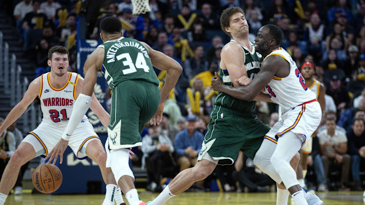 Mar 18, 2025; San Francisco, California, USA; Milwaukee Bucks center Brook Lopez (center) sets a screen for teammate Giannis Antetokounmpo (34) against Golden State Warriors forward Draymond Green (23) during the fourth quarter at Chase Center. Mandatory Credit: D. Ross Cameron-Imagn Images Mar 18, 2025; San Francisco, California, USA; Milwaukee Bucks center Brook Lopez (center) sets a screen for teammate Giannis Antetokounmpo (34) against Golden State Warriors forward Draymond Green (23) during the fourth quarter at Chase Center. Mandatory Credit: D. Ross Cameron-Imagn Images