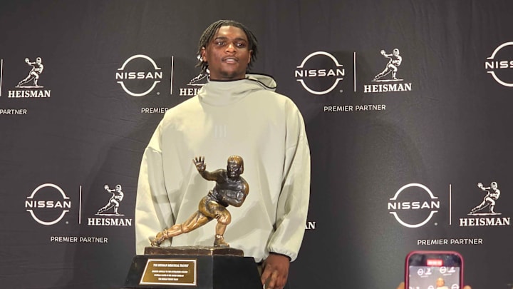 Cam Ward posing with the Heisman Trophy in New York before the Heisman Ceremony 