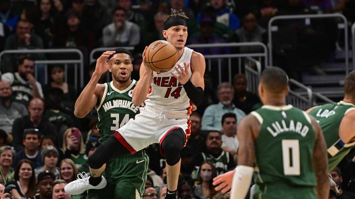 Oct 30, 2023; Milwaukee, Wisconsin, USA; Miami Heat guard Tyler Herro (14) grabs a rebound against Milwaukee Bucks forward Giannis Antetokounmpo (34) in the first quarter at Fiserv Forum. Mandatory Credit: Benny Sieu-Imagn Images Oct 30, 2023; Milwaukee, Wisconsin, USA; Miami Heat guard Tyler Herro (14) grabs a rebound against Milwaukee Bucks forward Giannis Antetokounmpo (34) in the first quarter at Fiserv Forum. Mandatory Credit: Benny Sieu-Imagn Images