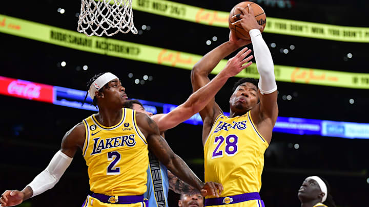 Mar 7, 2023; Los Angeles, California, USA; Los Angeles Lakers forward Rui Hachimura (28) gets the rebound in front of forward Jarred Vanderbilt (2) against the Memphis Grizzlies during the second half at Crypto.com Arena. Mandatory Credit: Gary A. Vasquez-Imagn Images