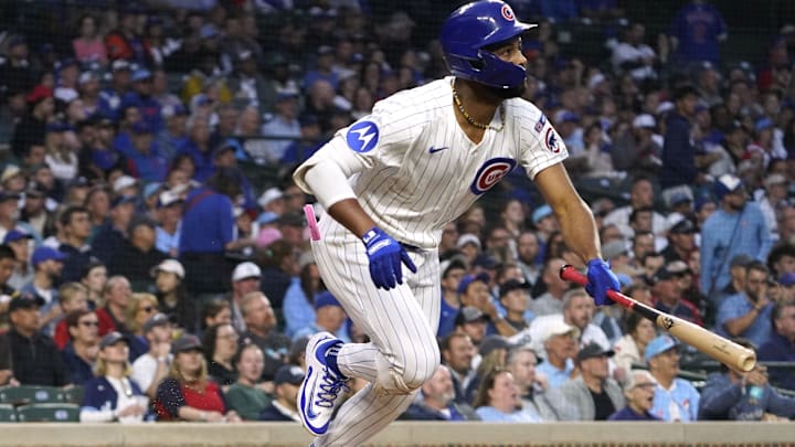 Sep 3, 2025; Chicago, Illinois, USA; Chicago Cubs outfielder Willi Castro (1) hits a one run single against the Atlanta Braves during the second inning at Wrigley Field. Mandatory Credit: David Banks-Imagn Images