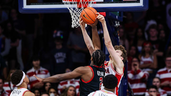 Feb 26, 2025; Tucson, Arizona, USA; Arizona Wildcats forward Henri Veesaar (13) fouls Utah Utes forward Ezra Ausar (2) during the second half at McKale Center. Mandatory Credit: Aryanna Frank-Imagn Images