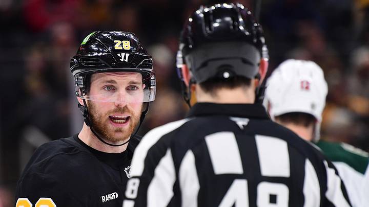 Mar 28, 2026; Boston, Massachusetts, USA; Boston Bruins center Elias Lindholm (28) speaks to the referee during the third period against the Minnesota Wild at TD Garden. Mandatory Credit: Bob DeChiara-Imagn Images