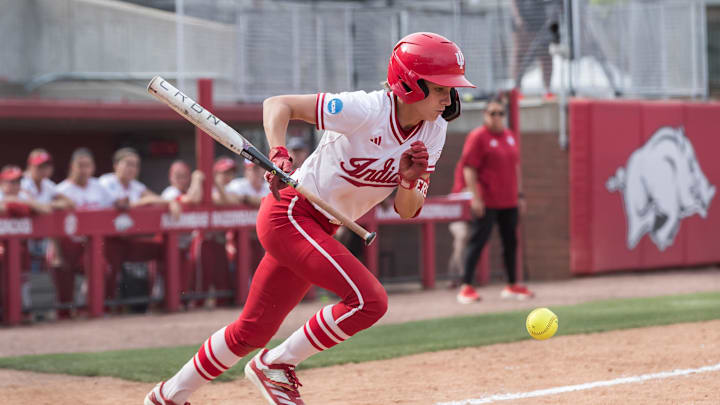 May 17, 2025; Fayetteville, AR, USA; Indiana Hoosiers outfielder Melina Wilkison (23) bunts the ball during the fifth inning against the Saint Louis Billikens. Indiana won 4-2. Mandatory Credit: Brett Rojo-Imagn Images May 17, 2025; Fayetteville, AR, USA; Indiana Hoosiers outfielder Melina Wilkison (23) bunts the ball during the fifth inning against the Saint Louis Billikens. Indiana won 4-2. Mandatory Credit: Brett Rojo-Imagn Images
