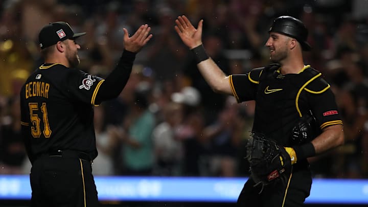Jul 26, 2025; Pittsburgh, Pennsylvania, USA;  Pittsburgh Pirates relief pitcher David Bednar (51) celebrates his one hundredth career MLB save with catcher Joey Bart (14) against the Arizona Diamondbacks at PNC Park. Mandatory Credit: Charles LeClaire-Imagn Images