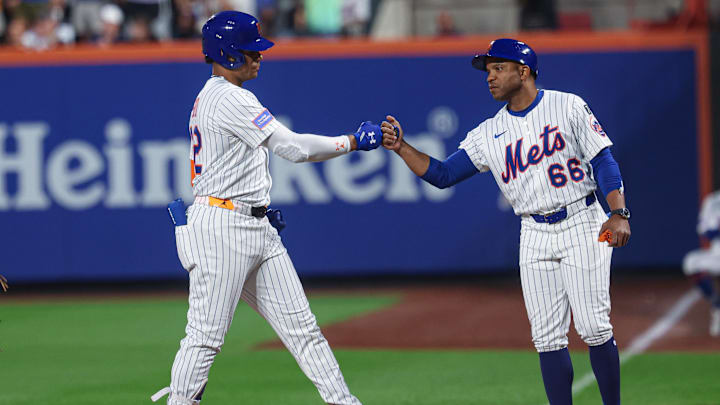 Soto has reached new heights as a base-stealer thanks to the shrewd coaching of Antoan Richardson (right). 
