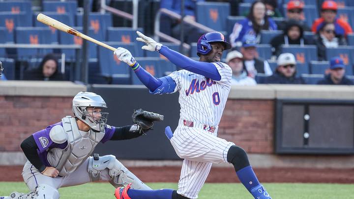 Apr 26, 2026; New York City, New York, USA;  New York Mets shortstop Ronny Mauricio (0) hits a single in the fifth inning Colorado Rockies at Citi Field. Mandatory Credit: Wendell Cruz-Imagn Images