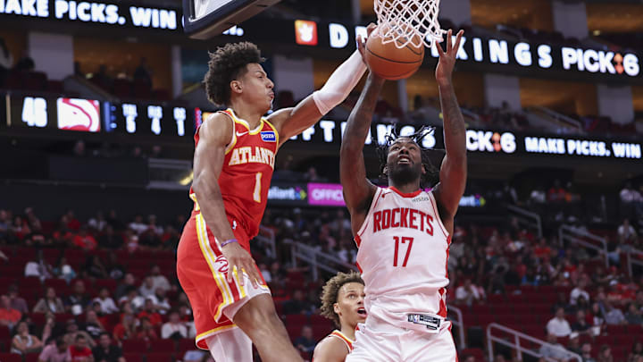 Oct 6, 2025; Houston, Texas, USA; Atlanta Hawks forward Jalen Johnson (1) blocks a shot by Houston Rockets forward Tari Eason (17) during the second quarter at Toyota Center. Mandatory Credit: Troy Taormina-Imagn Images Oct 6, 2025; Houston, Texas, USA; Atlanta Hawks forward Jalen Johnson (1) blocks a shot by Houston Rockets forward Tari Eason (17) during the second quarter at Toyota Center. Mandatory Credit: Troy Taormina-Imagn Images