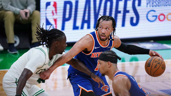 New York Knicks guard Jalen Brunson moves the ball against Boston Celtics guard Jrue Holiday. Mandatory Credit: David Butler II-Imagn Images